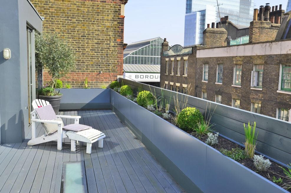 Rooftop planters as perimeter wall