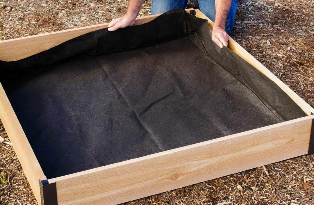 Fabric liner for planters and beds